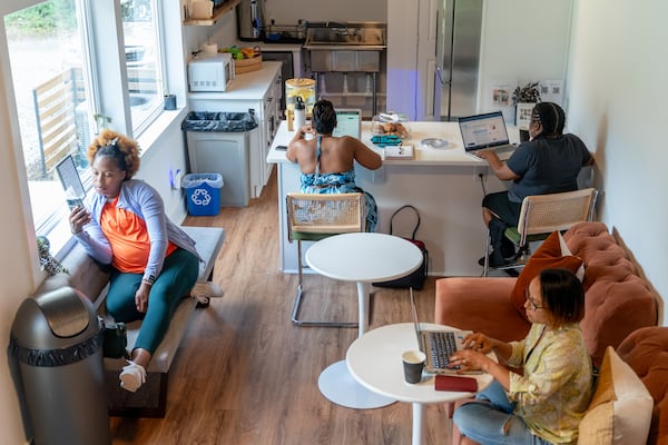 Epiphany Wells-Booker (left) and other women work inside the cafe at The Rest Spot, a women's-only rest and coworking space in Smyrna. Ben Hendren for the Atlanta Journal-Constitution