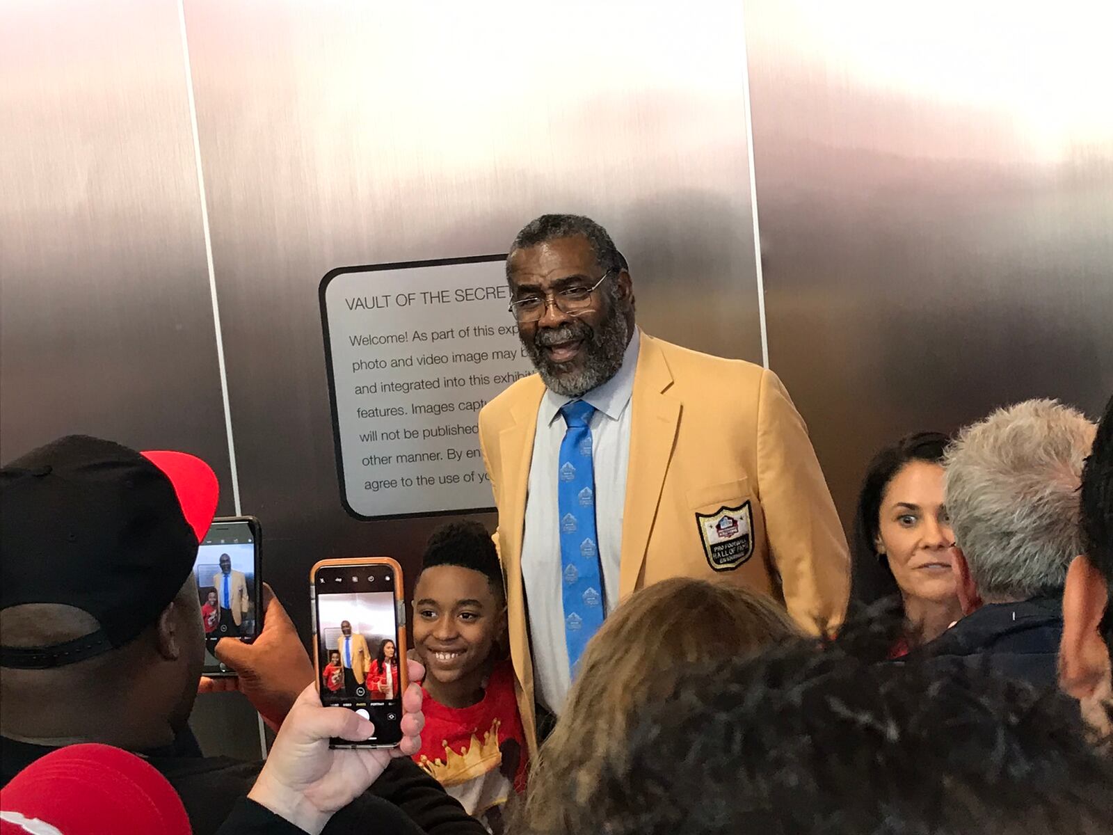 Four-time Super Bowl champ "Mean" Joe Greene, now 72, poses for pictures with fans at the World of Coke.