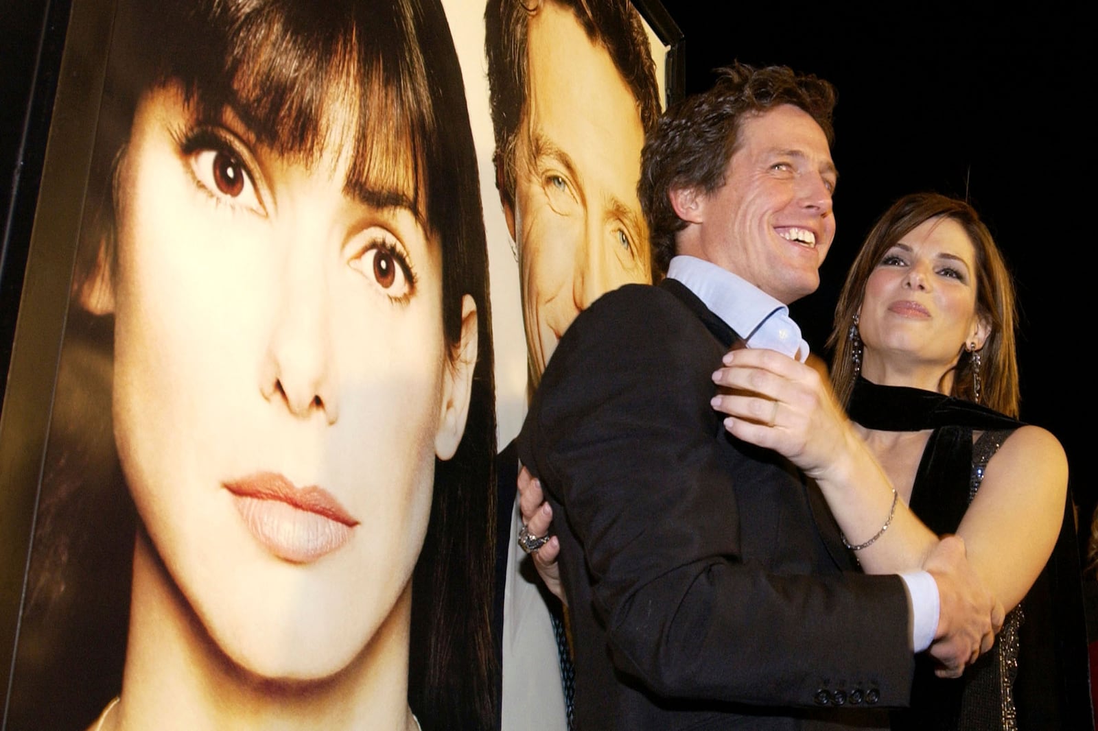 FILE - Actors Hugh Grant, left, and Sandra Bullock appear at a screening of their film, "Two Weeks Notice," in the Westwood section of Los Angeles, on Dec. 18, 2002. (AP Photo/Chris Weeks, File)