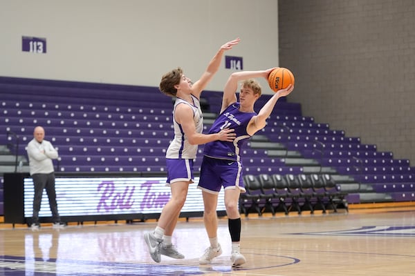 St. Thomas guards Hayden Tibbits, center left, and Drake Dobbs (11) take part in drills during NCAA college basketball practice, Wednesday, Feb. 26, 2025, in St. Paul, Minn. (AP Photo/Abbie Parr)