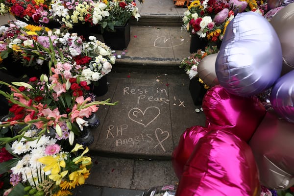 FILE - Tributes are seen outside the Town Hall in Southport, England, Monday, Aug. 5, 2024 after three young girls were killed in a knife attack at a Taylor Swift-themed holiday club the week before. (AP Photo/Darren Staples, File)