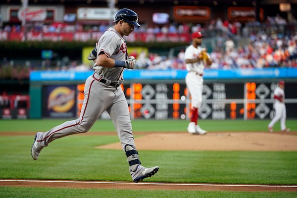 Atlanta Braves' Austin Riley, left, rounds the bases after hitting a two-run home run against Philadelphia Phillies pitcher Cristopher Sanchez during the first inning of a baseball game, Wednesday, Sept. 13, 2023, in Philadelphia. (AP Photo/Matt Slocum)