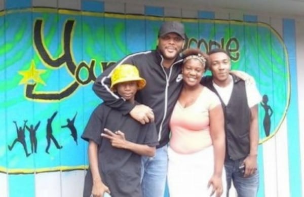 Tyler Perry with kids at Young People Matter