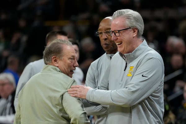 Michigan State head coach Tom Izzo, left, greets Iowa head coach Fran McCaffery before an NCAA college basketball game, Thursday, March 6, 2025, in Iowa City, Iowa. (AP Photo/Charlie Neibergall)