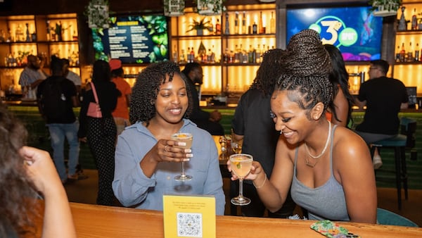 Two friends catch up and connect at Your 3rd Spot, a Westside social entertainment venue. (Courtesy of Amp Up 1 Hospitality) 