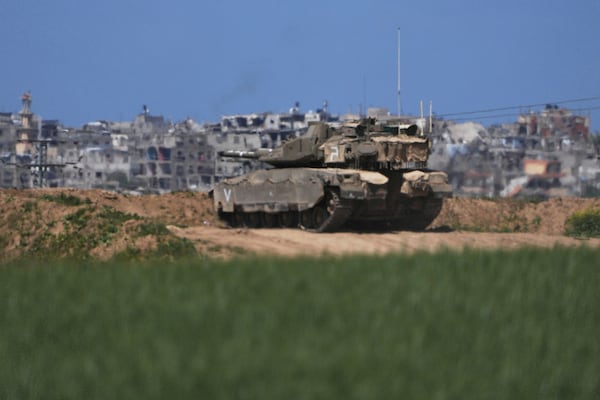 An Israeli tank takes position on the Gaza Strip border in southern Israel, Wednesday, March 19, 2025. (AP Photo/Ariel Schalit)