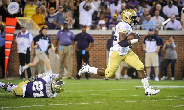 Georgia Tech running back Marcus Marshall (34) gets away from Alcorn State defensive back Quinton Cantue (21) as he runs for a touchdown during the first quarter of an NCAA college football game, Thursday, Sept. 3, 2015, in Atlanta. (AP Photo/John Amis)