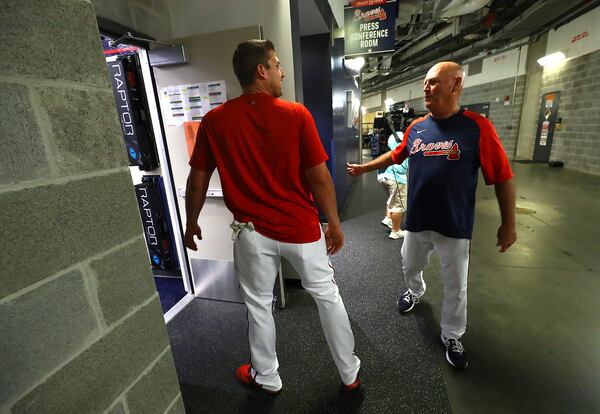 Braves third baseman Austin Riley gets congratulations from manager Brian Snitker after his press conference.   “Curtis Compton / Curtis Compton@ajc.com