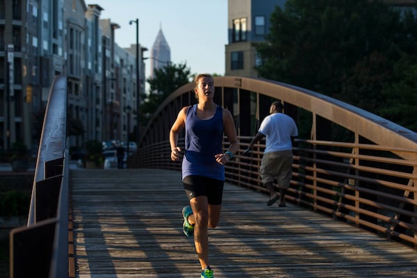 A runner takes advantage of the drier conditions and cooler temperatures in Atlanta on Wednesday morning. ALYSSA POINTER / ALYSSA.POINTER@AJC.COM