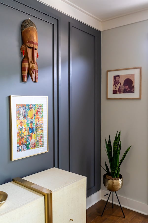 Amber Guyton's clients celebrate their heritage in this room decorated with tribal masks and a photograph of family members.
(Courtesy of Blessed Little Bungalow / Brittany Bah Photography)