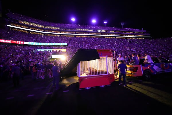 A live tiger is rolled into Tiger Stadium before an NCAA college football game between LSU and Alabama in Baton Rouge, La., Saturday, Nov. 9, 2024. (AP Photo/Gerald Herbert)