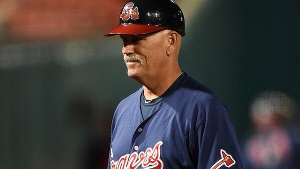 Gwinnett Braves manager Brian Snitker (4) walks to the dugout in between innings during a game against the Buffalo Bisons on May 13, 2014.  (Mike Janes/Four Seam Images via AP Images)