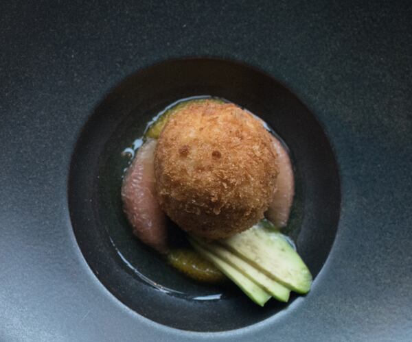 The crab fritter is a star at Bacchanalia, which appeared in “Baby Driver,” featuring Ansel Elgort (right) and Jamie Foxx. CONTRIBUTED BY HENRI HOLLIS