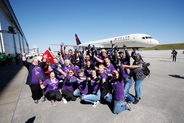 Hope Thrive team members react as they prepare to participate during the fundraising Delta Jet Drag event to benefit the American Cancer Society on Wednesday, May 3, 2023.
Miguel Martinez /miguel.martinezjimenez@ajc.com