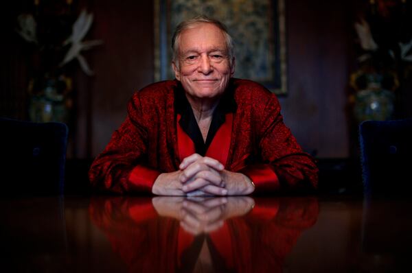 FILE - In this Nov. 4, 2010, file photo, Playboy magazine founder Hugh Hefner poses for photos at the Playboy Mansion in Los Angeles. The Playboy magazine founder and sexual revolution symbol Hefner has died at age 91. The magazine released a statement saying Hefner died at his home of natural causes on Wednesday night, Sept. 27, 2017, surrounded by family. (AP Photo/Jae C. Hong, File)