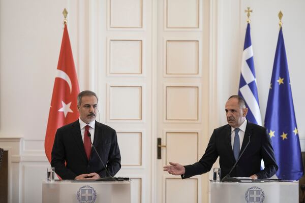 Greek Foreign Minister George Gerapetritis, right, speaks next to his Turkish counterpart Hakan Fidan during a join news conference and after their meeting, in Athens, Greece, Friday, Nov. 8, 2024. (AP Photo/Thanassis Stavrakis)