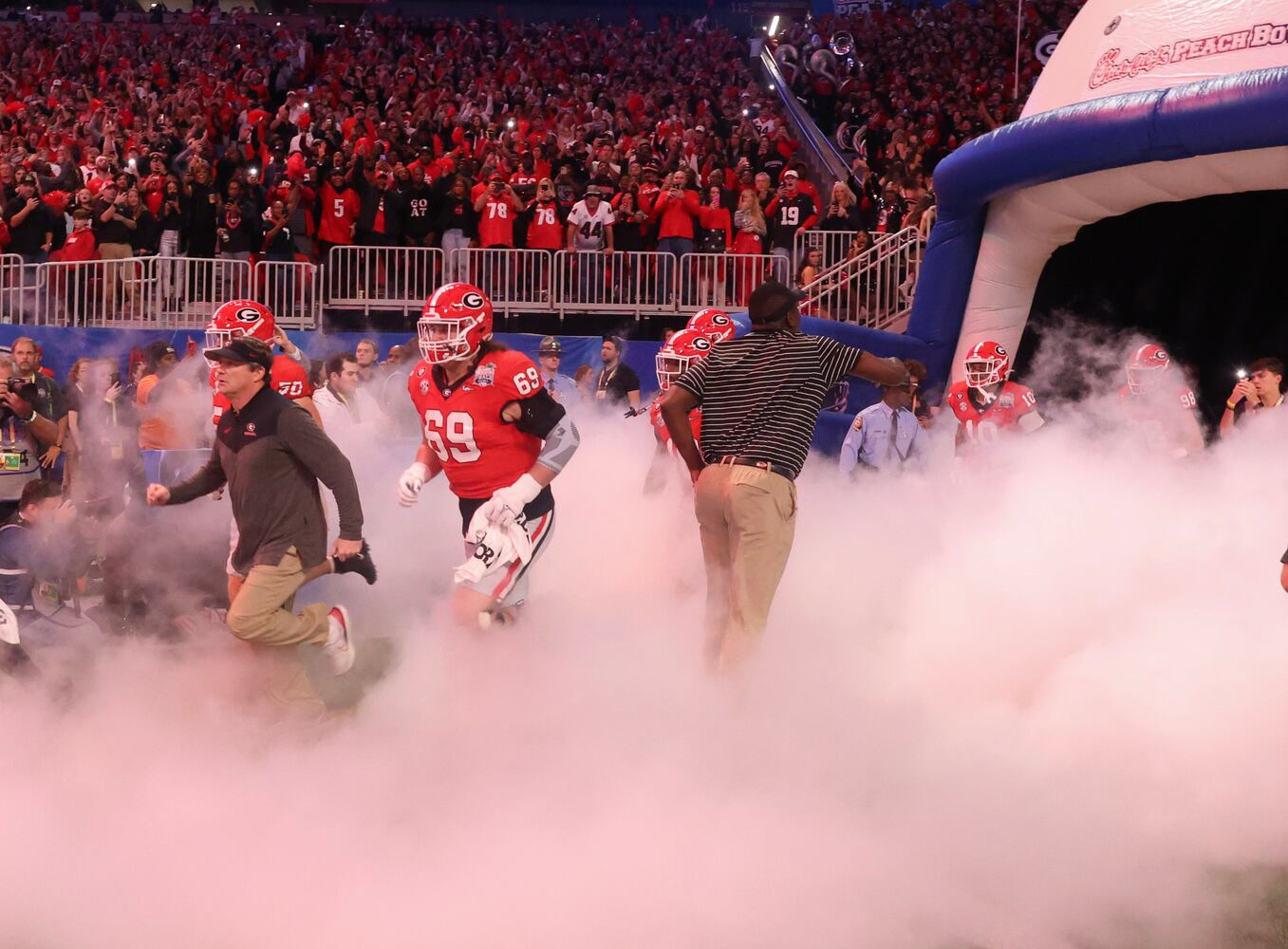 Georgia Bulldogs head coach Kirby Smart takes the field with his team before the College Football Playoff Semifinal between the Georgia Bulldogs and the Ohio State Buckeyes at the Chick-fil-A Peach Bowl In Atlanta on Saturday, Dec. 31, 2022. (Jason Getz / Jason.Getz@ajc.com)