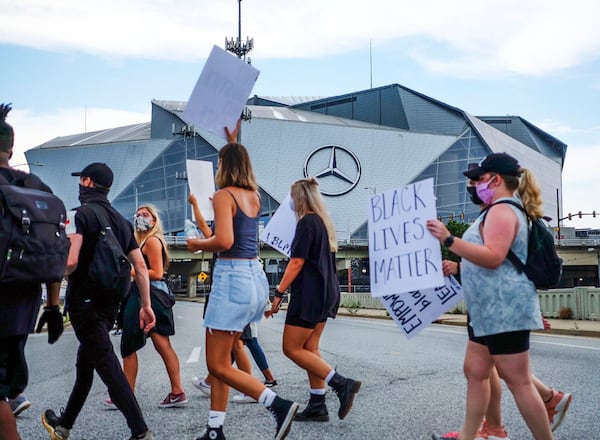 Groups of demonstrators gathered late Friday afternoon as protests continued in downtown Atlanta.