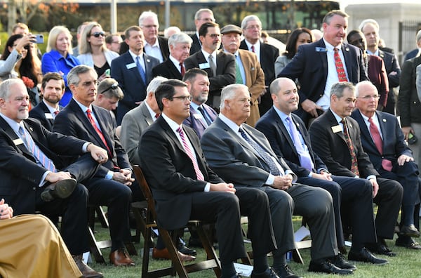 Guests including Lieutenant Governor Geoff Duncan (center left) and Speaker of the House David Ralston (center right) attend a press conference at Liberty Plaza across from the Georgia State Capitol in Atlanta on Thursday, December 16, 2021. Electric vehicle maker Rivian on Thursday confirmed its plans to build a $5 billion assembly plant and battery factory in Georgia, which Gov. Brian Kemp called "the largest single economic development project ever in this state's history." (Hyosub Shin / Hyosub.Shin@ajc.com)