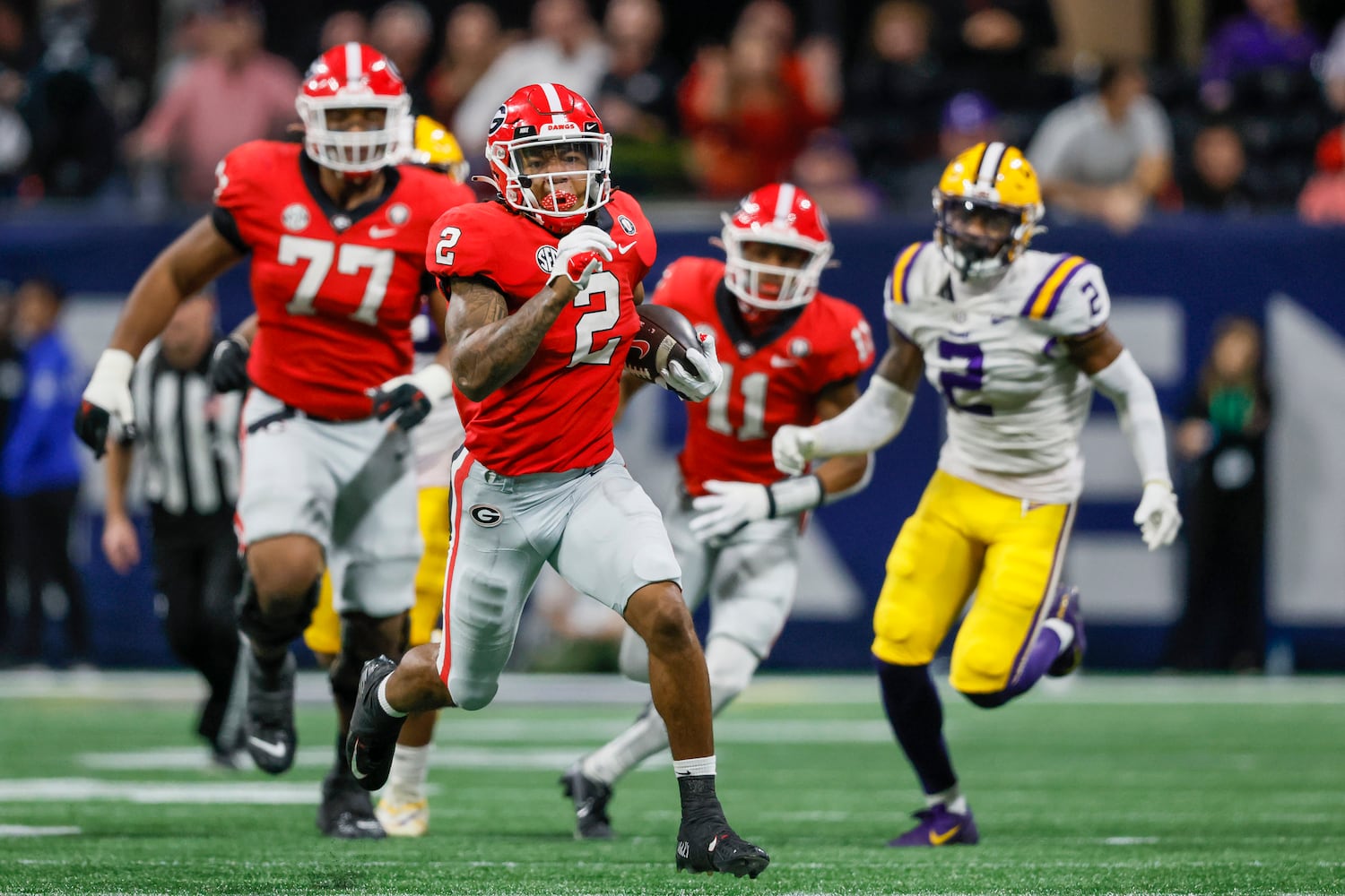 Georgia Bulldogs running back Kendall Milton (2) runs for a 51-yard gain against the LSU Tigers during the second half of the SEC Championship Game at Mercedes-Benz Stadium in Atlanta on Saturday, Dec. 3, 2022. (Jason Getz / Jason.Getz@ajc.com)