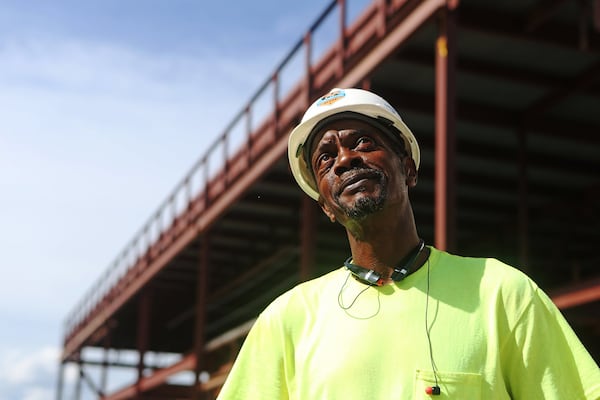 Jerome White stands along Joseph E. Lowery Boulevard in Atlanta. White, who did prison time for various drug-related offenses, now works as a laborer for a large construction company. “The hard work keeps me motivated to better myself,” he said. Christina Matacotta/Christina.Matacotta@ajc.com