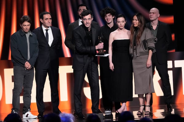 Alex Coco, center, accepts the award for best feature for "Anora" during the Film Independent Spirit Awards on Saturday, Feb. 22, 2025, in Santa Monica, Calif. Joining him onstage, from left, are Sean Baker, Karren Karagulian, Vache Tovmasyan, Mark Eydelshteyn, Mikey Madison, Samantha Quan and Yura Borisov. (AP Photo/Chris Pizzello)