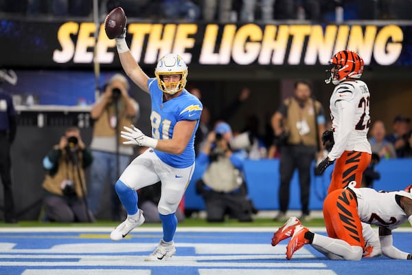 Los Angeles Chargers tight end Will Dissly (81) celebrates his touchdown catch during the first half of an NFL football game against the Cincinnati Bengals, Sunday, Nov. 17, 2024, in Inglewood, Calif. (AP Photo/Eric Thayer)