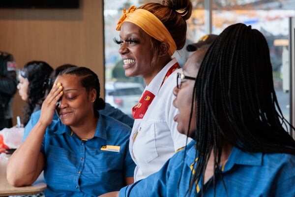 McDonald’s managers Sha’querria Kaigler (from left), Keisha Blue-Murray and Tunisia Woodward wait for a baby shower at the restaurant on Wednesday. The three helped deliver a baby in the restaurant bathroom the day before Thanksgiving.