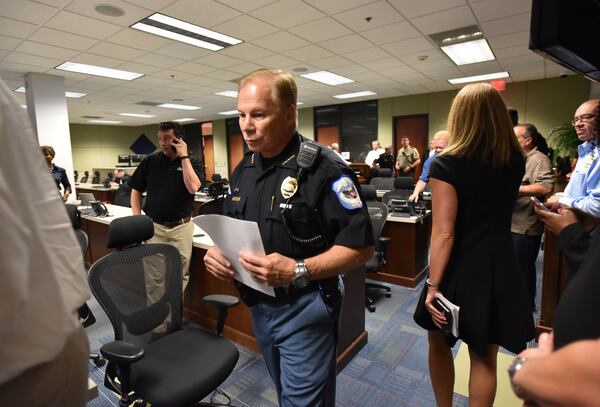 Cobb County Police Chief Mike Register enters the room  for a press conference at Emergency Operations Center in Marietta on Thursday, August 31, 2017.  HYOSUB SHIN / HSHIN@AJC.COM