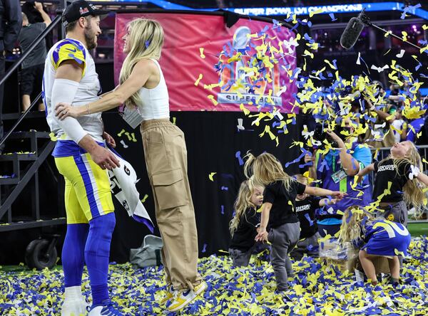 Los Angeles Rams quarterback Matthew Stafford is embraced by his wife, Kelly, as their children frolic in confetti after the Rams defeated the Cincinnati Bengals in the Super Bowl. (Robert Gauthier/Los Angeles Times/TNS)