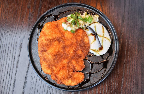 Pork Schnitzel, pickled potatoes, pumpkin seed oil.(Contributed by Chris Hunt Photography)