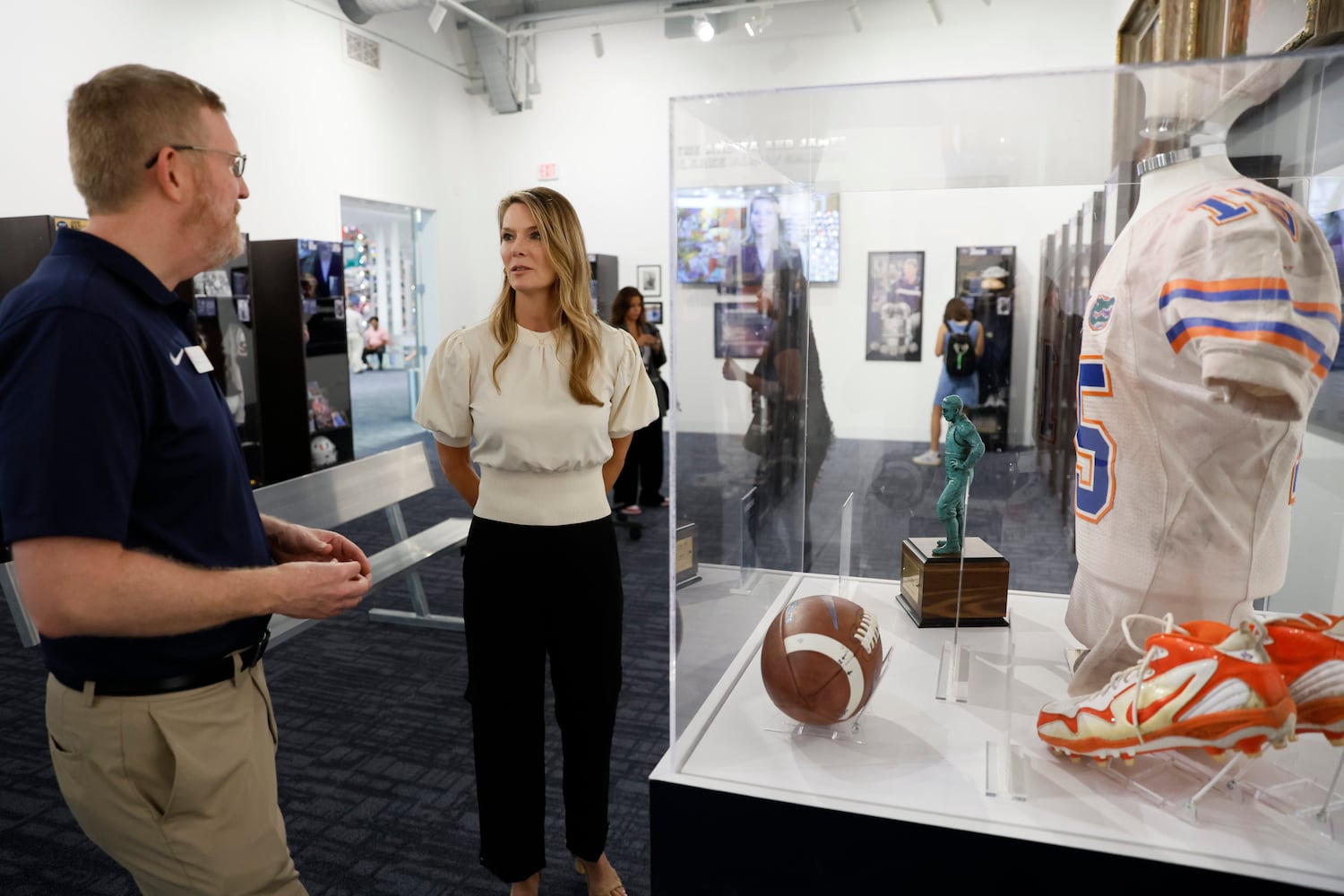 Historian and exhibit designer with the College Football Hall of Fame Museum Denis Crawford interacts with President & CEO Kimberly Beaudin as they walk through the new installation honoring the 22 members of the 2023 Hall of Fame class on Thursday, Sept. 28, 2023, in Atlanta.
Miguel Martinez /miguel.martinezjimenez@ajc.com