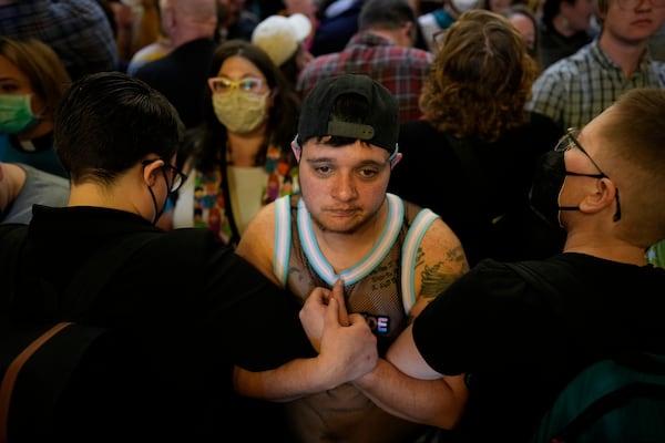 Protesters fill the Iowa state Capitol to denounce a bill that would strip the state civil rights code of protections based on gender identity, Thursday, Feb. 27, 2025, in Des Moines, Iowa. (AP Photo/Charlie Neibergall)