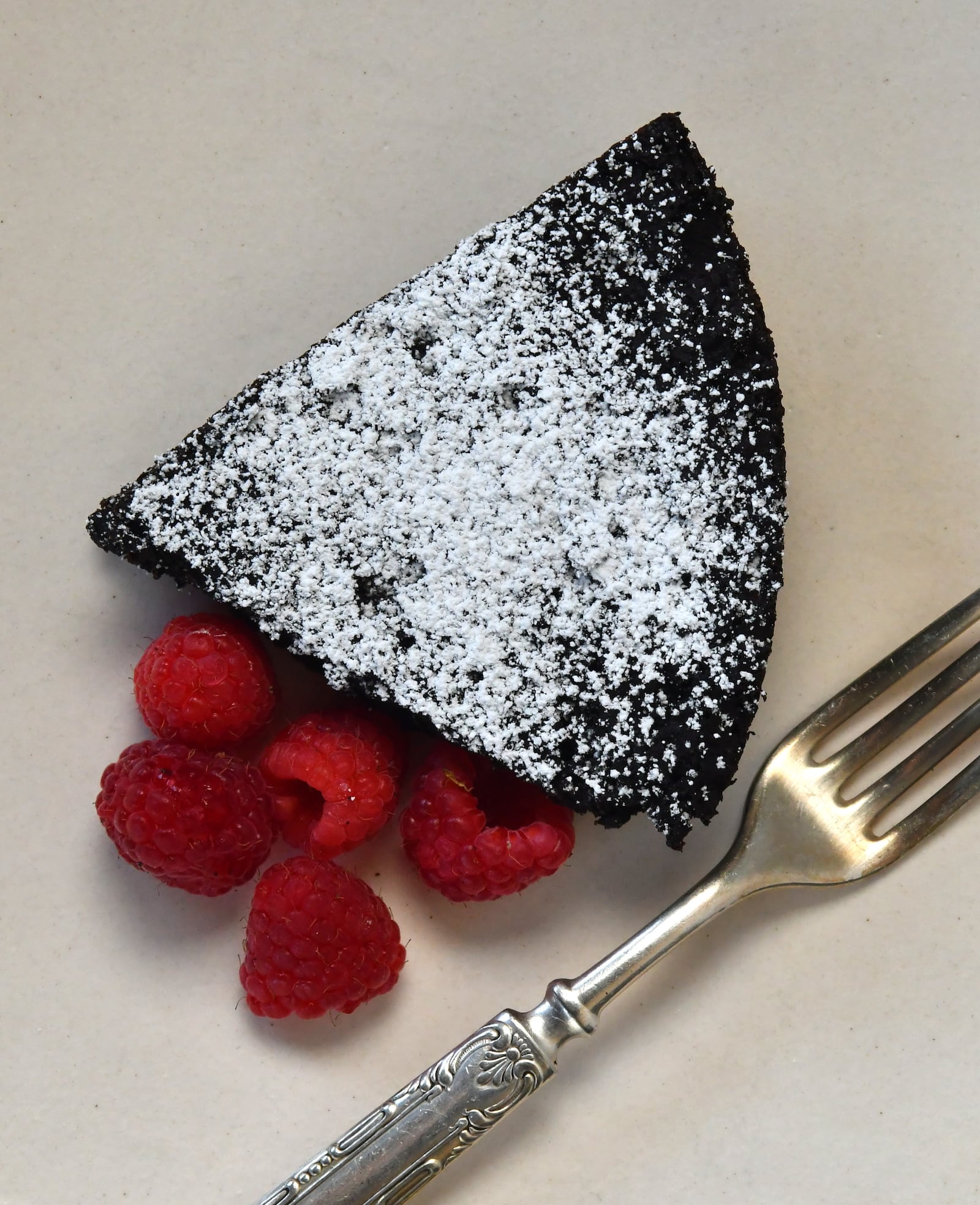 Yes, you can make a cake without flour. Fonio Chocolate Cake with Raspberries uses fonio, a grain native to West Africa. (Styling by Lisa Hanson / Chris Hunt for the AJC)