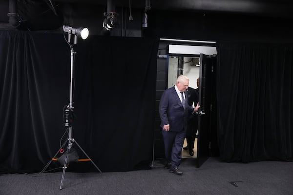 Ontario Premier Doug Ford arrives to speak to the media in the Queen's Park Legislature in Toronto on Thursday Dec. 12, 2024. (Chris Young/The Canadian Press via AP)