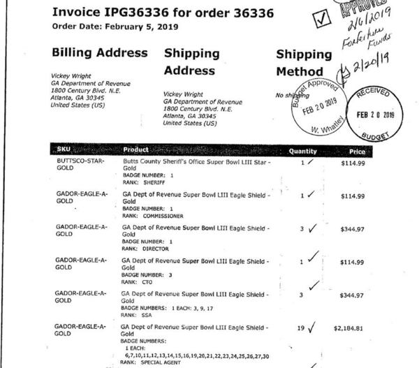 A 2019 invoice shows the purchase of commemorative Super Bowl badges by the Department of Revenue using seized funds from investigations.