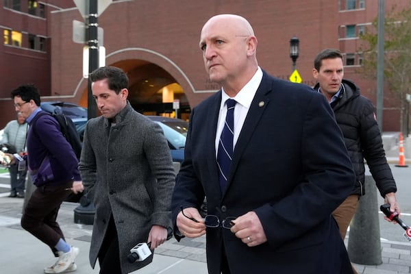 Thomas Dufault, center right, stepfather of Massachusetts Air National Guardsman Jack Teixeira, departs federal court, Tuesday, Nov. 12, 2024, in Boston, following a sentencing hearing for Jack Teixeira. (AP Photo/Steven Senne)