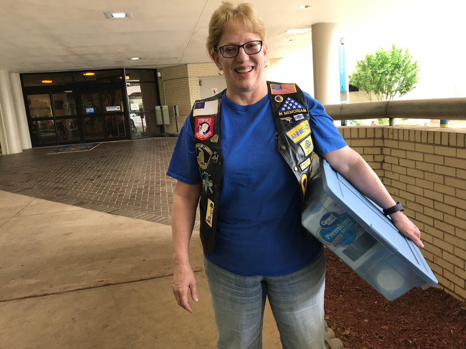 Anne O'Dea  brings cups, spoons and a cooler full of ice cream to the Eagle's Nest Community Living Center  in Decatur in preparation for an ice cream social she will host for the veterans who live there. BO EMERSON/BEMERSON@AJC.COM