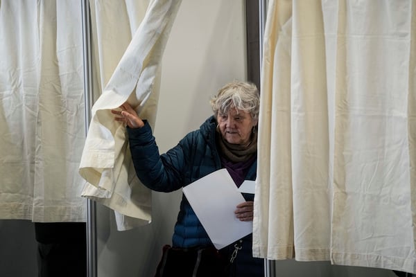 A woman casts her vote in parliamentary elections in Nuuk, Greenland, Tuesday, March 11, 2025. (AP Photo/Evgeniy Maloletka)