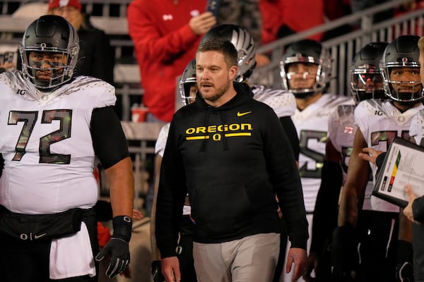 Oregon head coach Dan Lanning leads his team to the field before an NCAA college football game against Wisconsin Saturday, Nov. 16, 2024, in Madison, Wis. (AP Photo/Morry Gash)