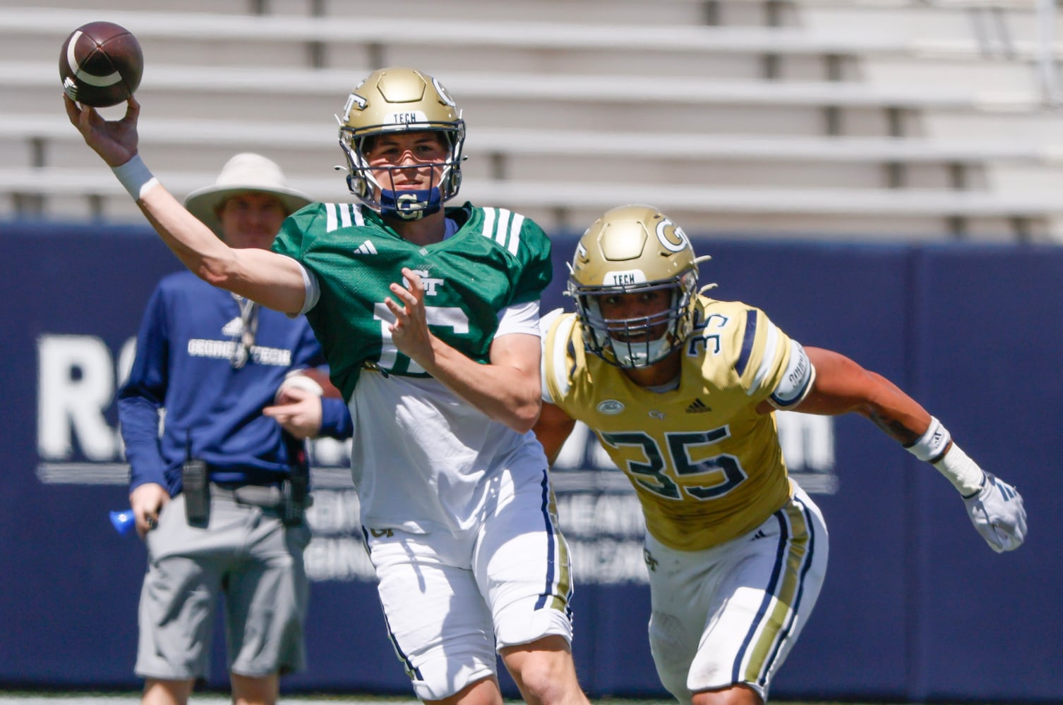 Georgia Tech quarterback Brody Rhodes (16) throws downfield as Georgia Tech linebacker Jacob Cruz (35) pursues him during the Spring White and Gold game at Bobby Dodd Stadium at Hyundai Field In Atlanta on Saturday, April 13, 2024.   (Bob Andres for the Atlanta Journal Constitution)