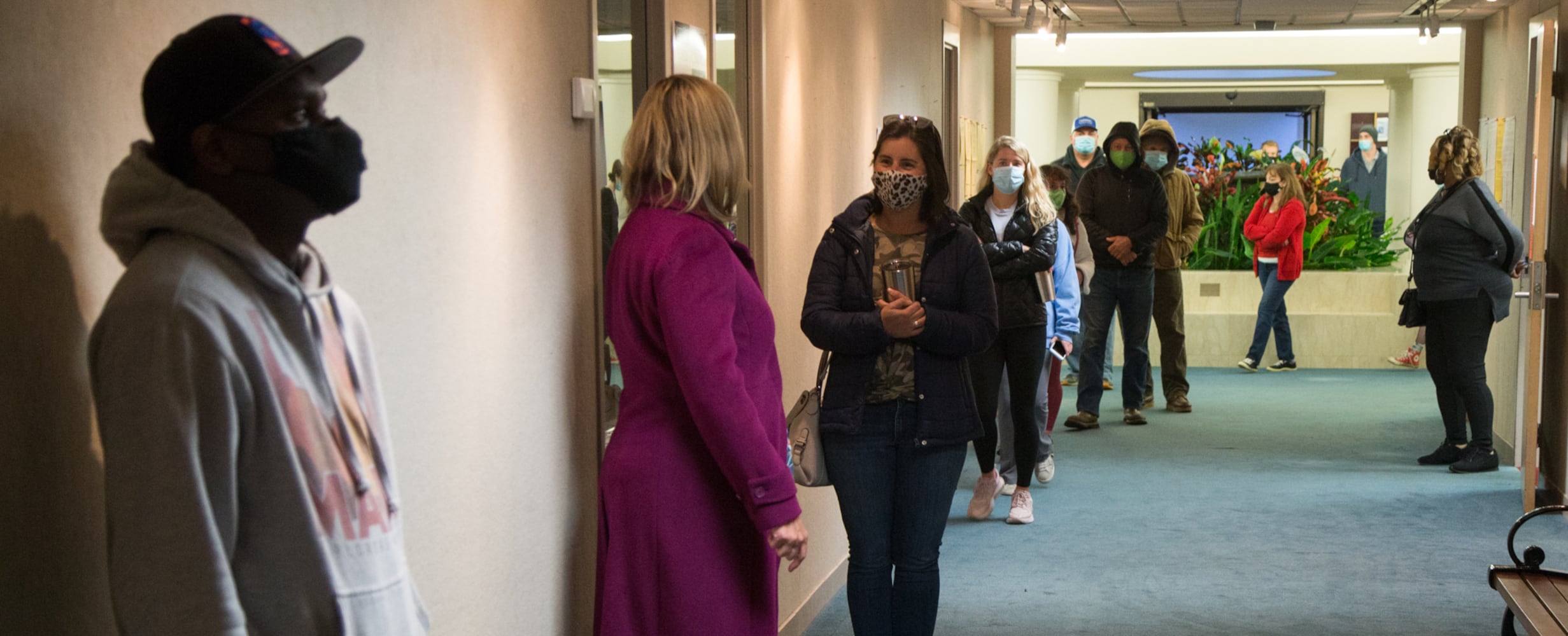 Voters wait in like at the Dunwoody Library as the polls opened at 7am on election day Nov 3rd, 2020. PHIL SKINNER FOR THE ATANTA JOURNAL-CONSTITUTION