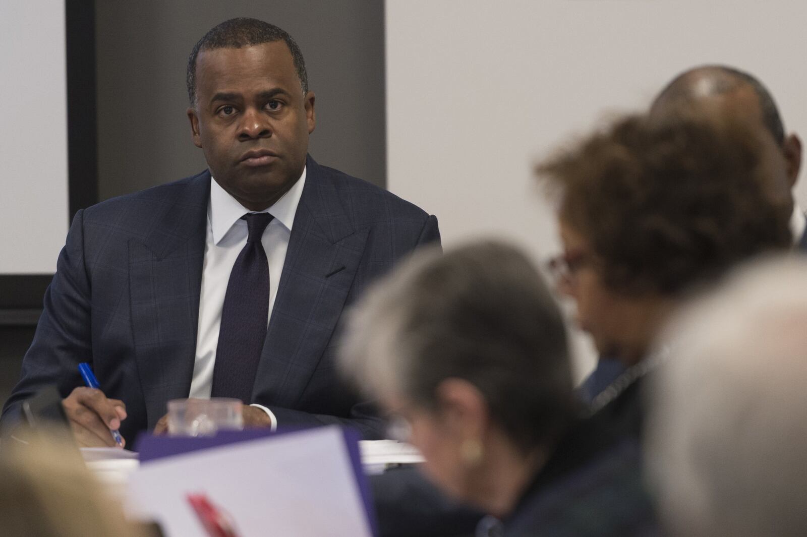 Mayor Kasim Reed, left, listens to public comments in March opposing the sale of Underground Atlanta to the real estate investment group WRS, Inc., during an Invest Atlanta board of directors meeting in Atlanta, Georgia. Despite those that came forward in opposition, the board approved the sale. (DAVID BARNES / SPECIAL)