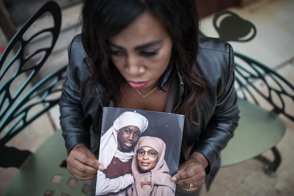 Joy Fluker poses for a portrait holding a photo of her and her mother, Anna Elizabeth Young, who was arrested for killing a young boy in Florida, Thursday, Dec. 7, 2017, in Woodstock, Ga.  BRANDEN CAMP/SPECIAL