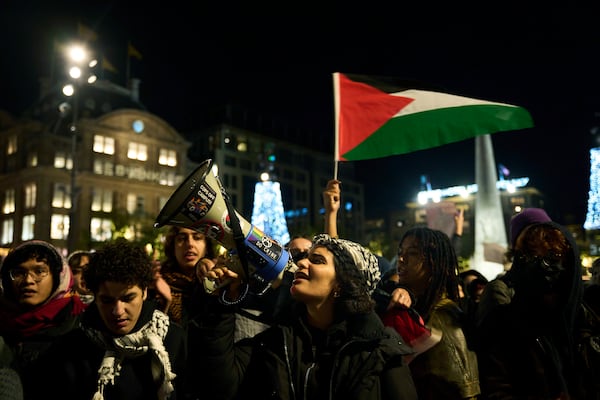 Pro-Palestinian supporters protest in Amsterdam, Netherlands, Wednesday, Nov. 13, 2024, despite a new city ban on such gatherings. (AP Photo/Bram Janssen)