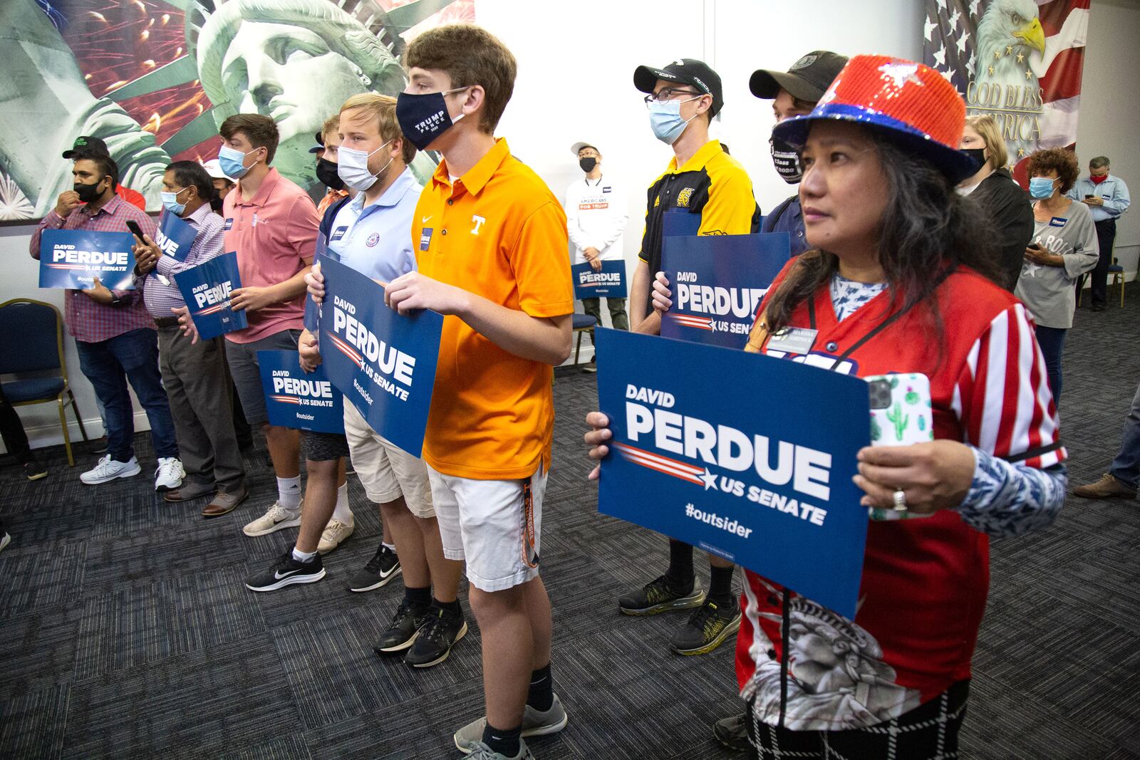 
 Senator David Perdue supporters listen to him speak at a canvass kick-off event at the Republican Party Headquarters in Marietta Saturday, October 10, 2020.  STEVE SCHAEFER / SPECIAL TO THE AJC 