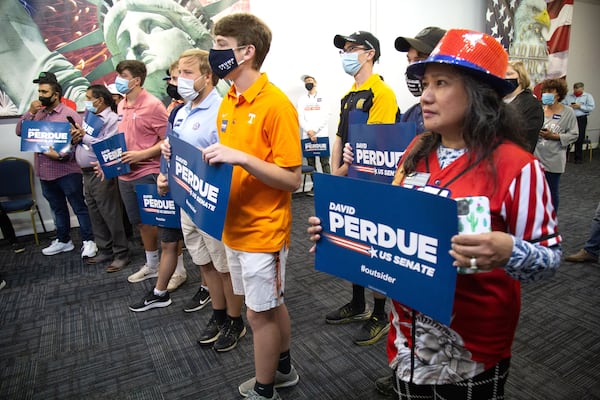 
 Senator David Perdue supporters listen to him speak at a canvass kick-off event at the Republican Party Headquarters in Marietta Saturday, October 10, 2020.  STEVE SCHAEFER / SPECIAL TO THE AJC 