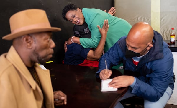 211120-Atlanta-Atlanta Mayoral candidate Felicia Moore hugs Maple Steel after talking to the cook at My Coffee Shop in East Lake on Saturday, Nov. 20, 2021. Ben Gray for the Atlanta Journal-Constitution