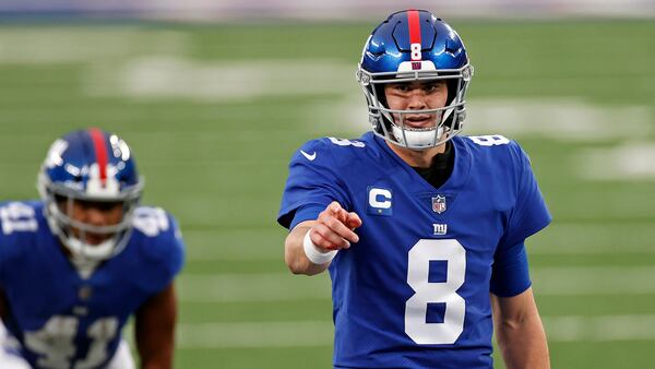 New York Giants quarterback Daniel Jones (8) signals for protection against the Dallas Cowboys, Sunday, Jan. 3, 2021, in East Rutherford, N.J. (Adam Hunger/AP)