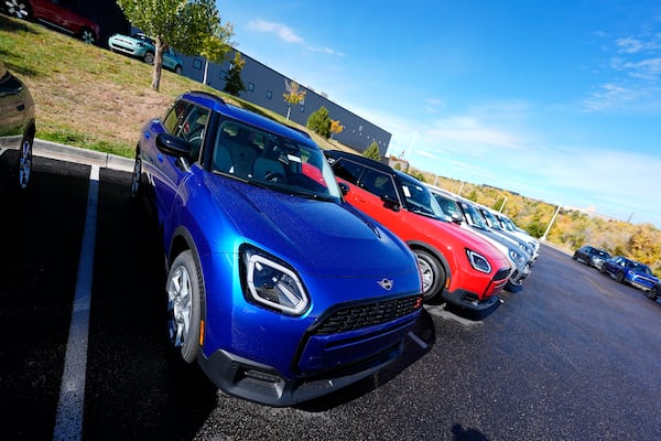 FILE - Unsold 2025 Countryman sports-utility vehicles sit on display at a Mini dealership on Oct. 21, 2024, in Highlands Ranch, Colo. (AP Photo/David Zalubowski, File)